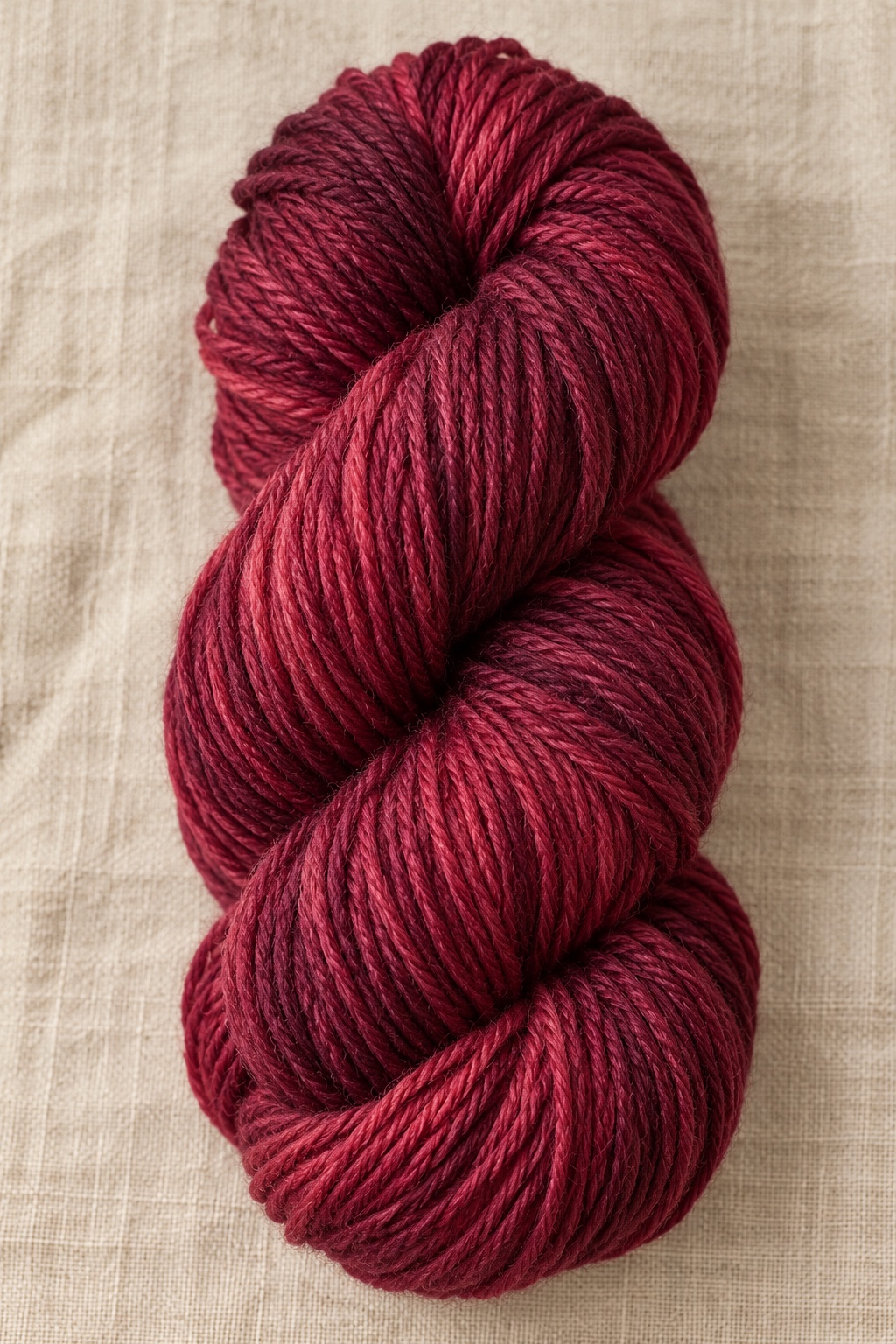Cranberry hand-dyed yarn skein